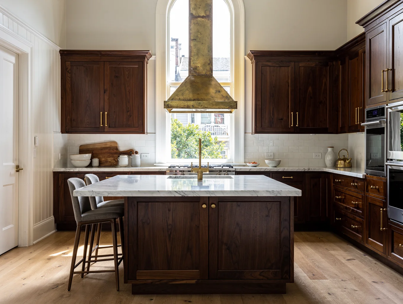 Renovated chef kitchen in San Francisco Victorian home with custom cabinetry and honed stone surfaces